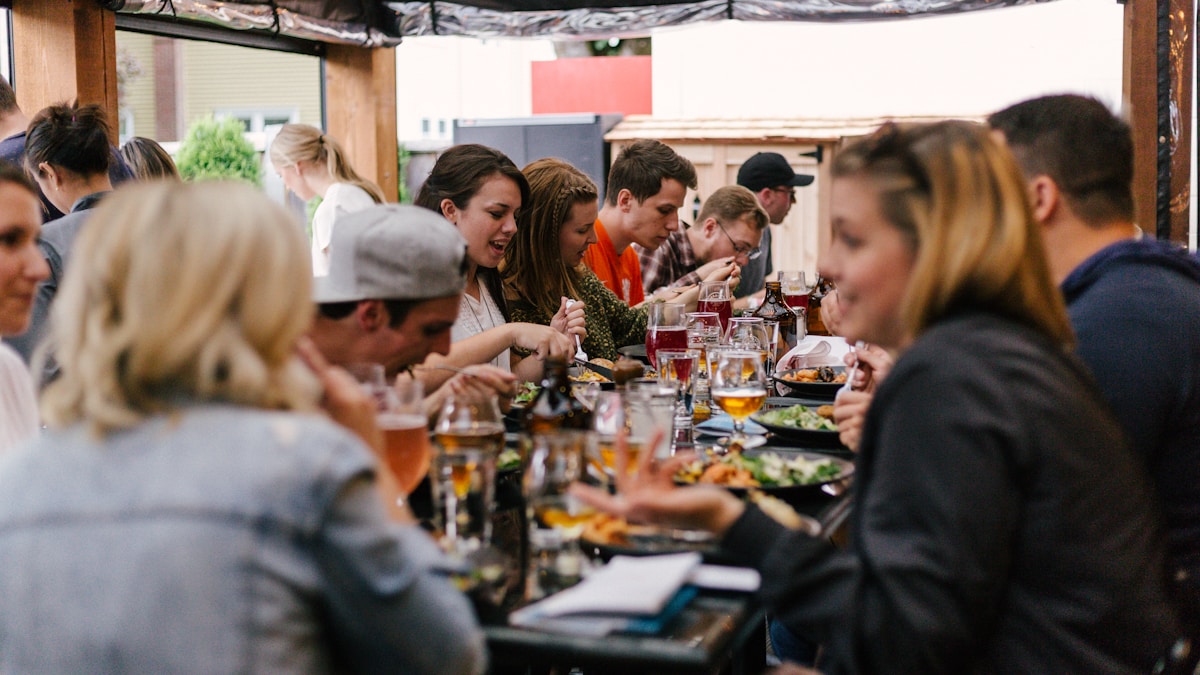 Group of people at a community networking event sharing ideas