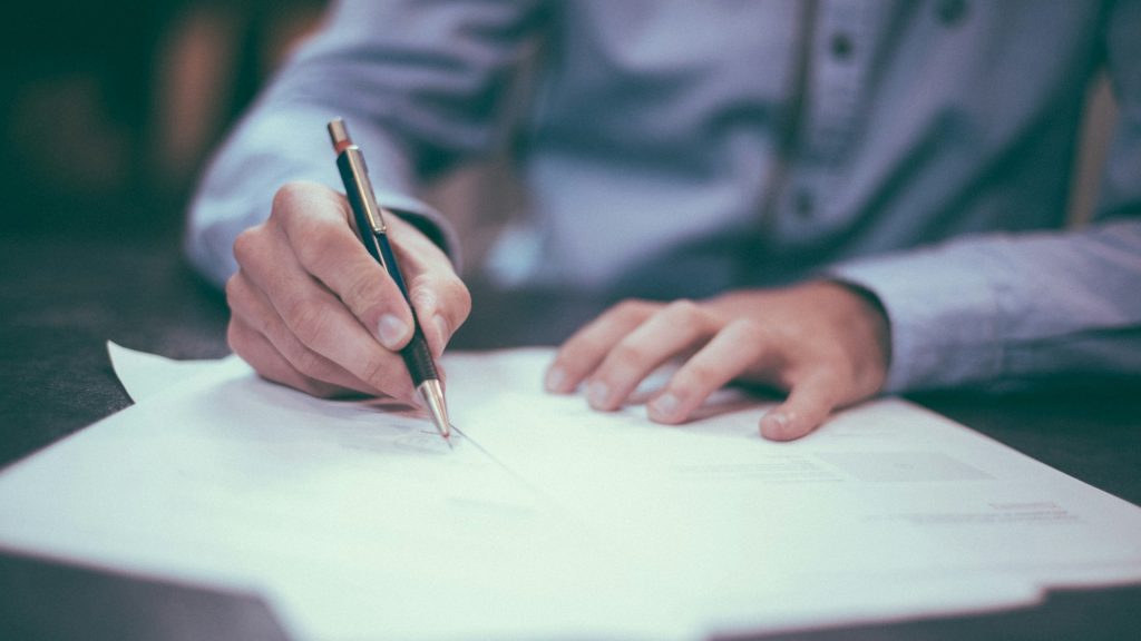 Hand writing a nonprofit grant application
