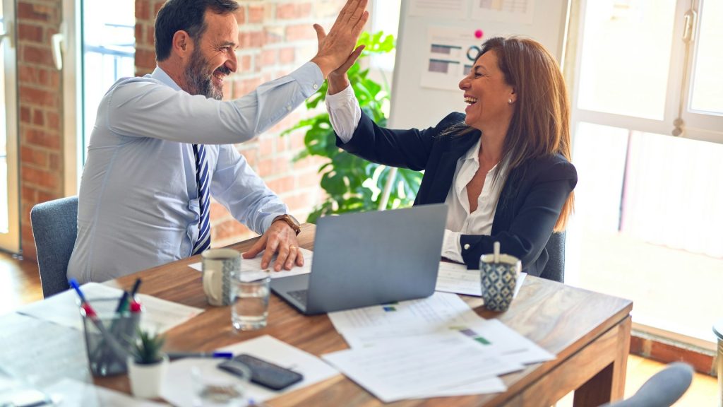 Nonprofit consultant celebrating a successful client strategy session