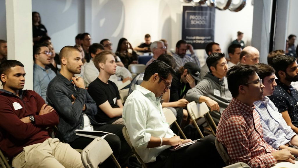 Engaged audience showing up at a community leadership event