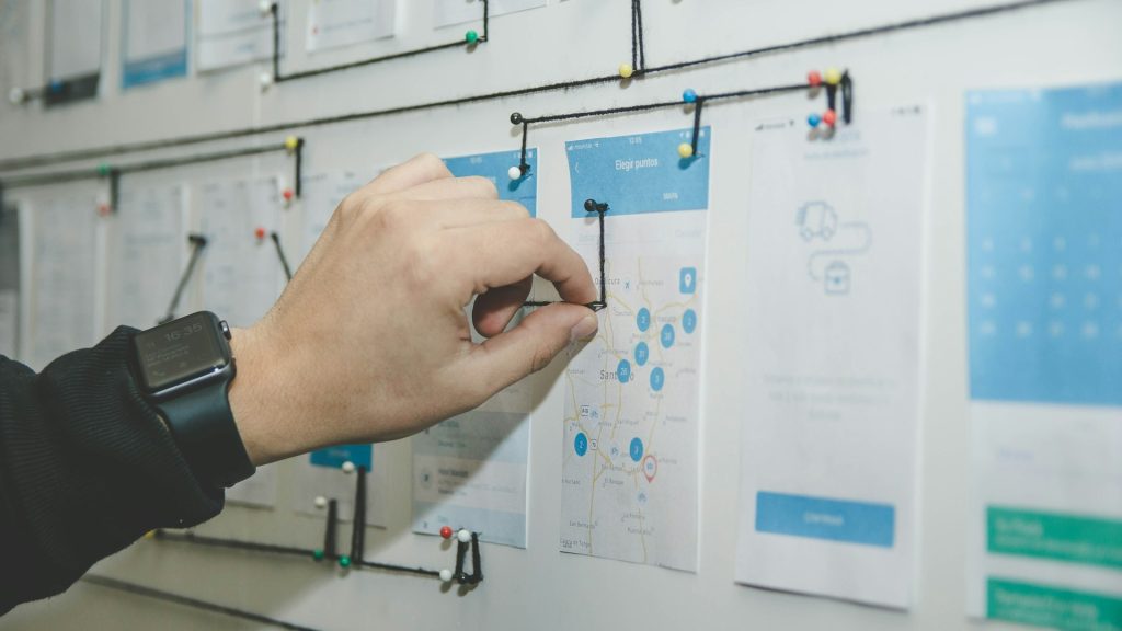 Entrepreneur validating a business idea on a planning whiteboard