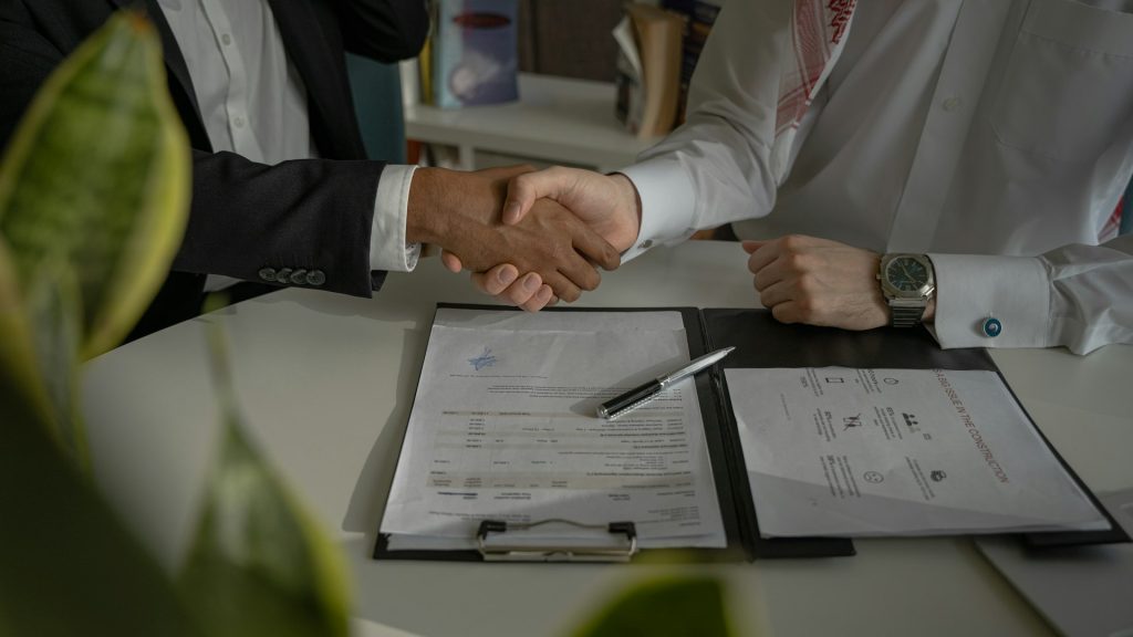 Event organiser and sponsor agreeing a partnership over a proposal