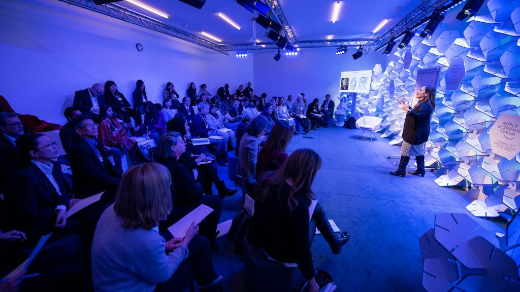 Speaker addressing an audience at a paid speaking engagement