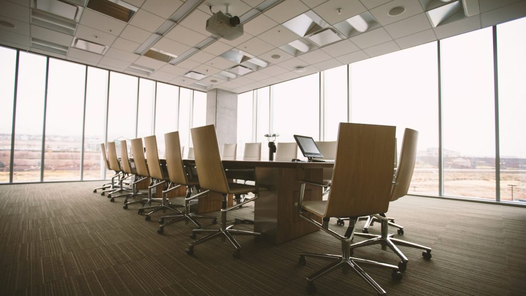 Empty nonprofit board room table before a directors meeting