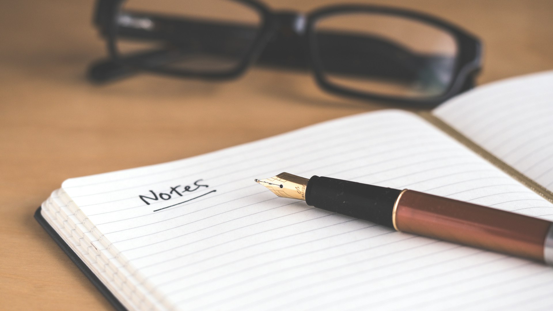 Notebook and pen used to structure a keynote speech