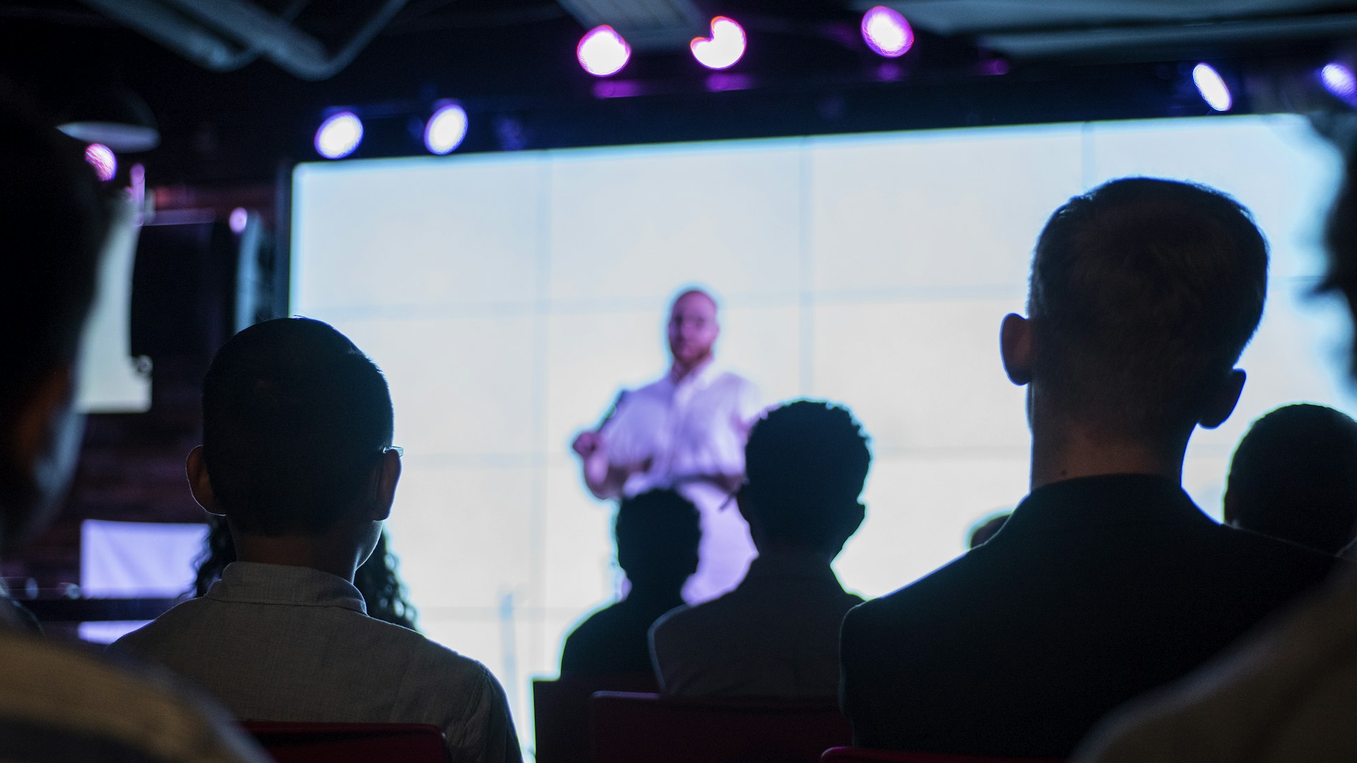 Conference audience applauding a keynote speaker