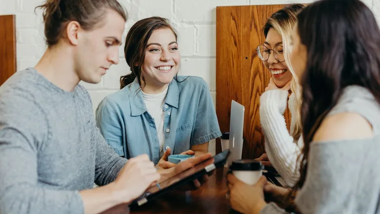 Two professionals collaborating while building a community from scratch